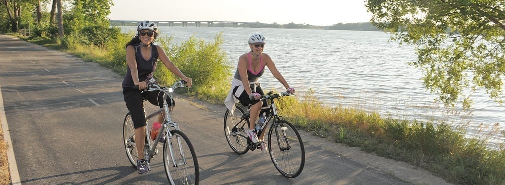 women biking, doing exercise